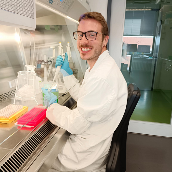 Aaron Kopydlowski preparing samples for RNA extraction under the sterile workbench.